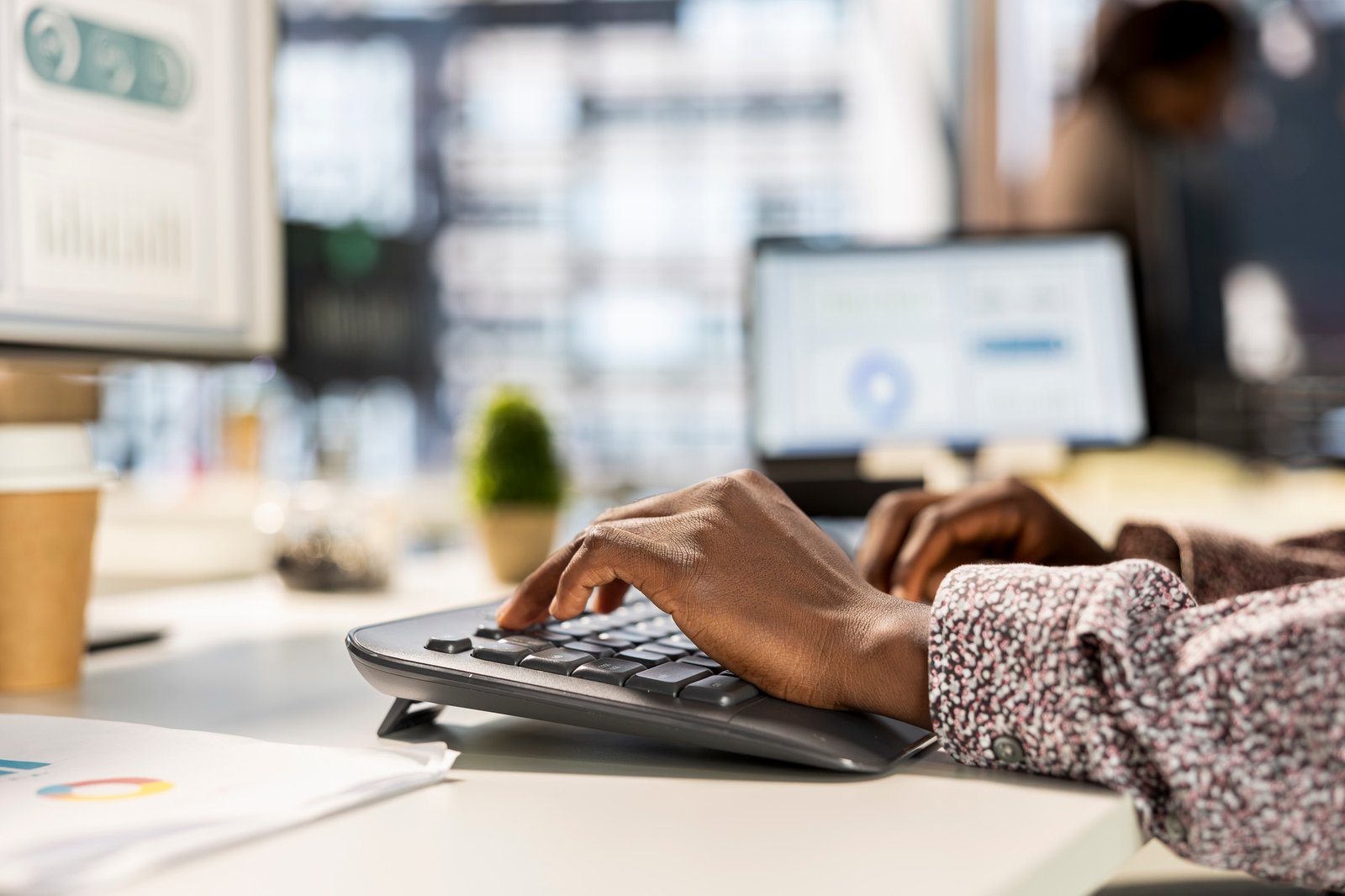 Businesswoman studying infographics and performance metrics