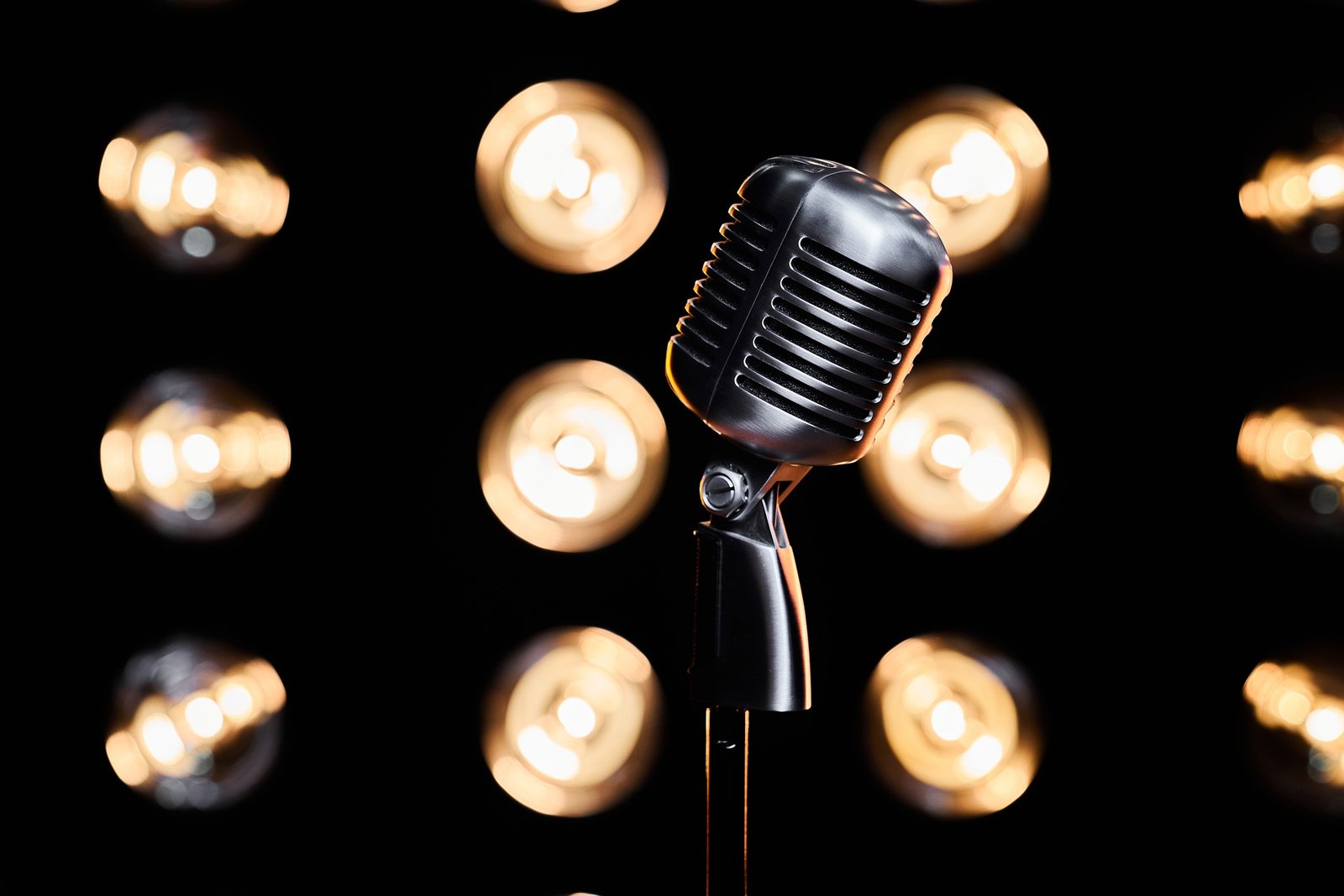 Retro mic on stand, placed on stage during event.